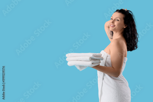 Young woman with clean towe...