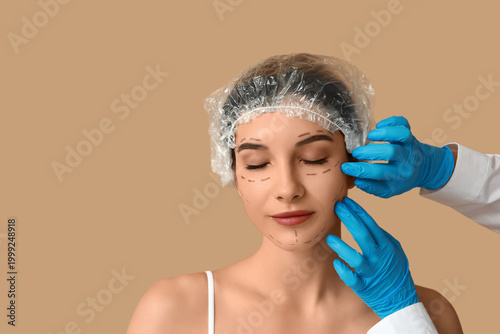Plastic surgeon marking wom...