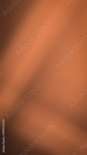 Abstract vertical orange brown and terracotta grainy gradient background with soft blur
