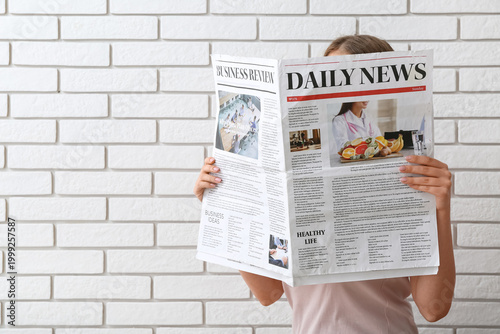 Woman reading morning newsp...