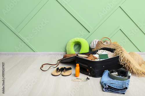 Suitcase with clothes, beac...