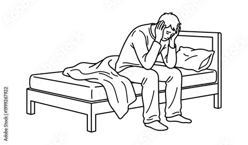 Distressed man sits on bed, head in hands, struggling with sadness and anxiety