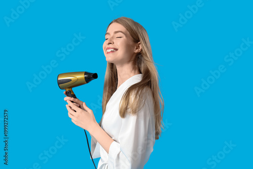 Young blonde woman with hai...