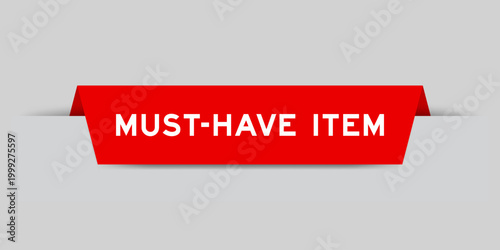 Fotografía Red color inserted label with word must have item on gray background