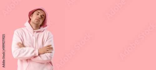 Stylish young man in hoodie...