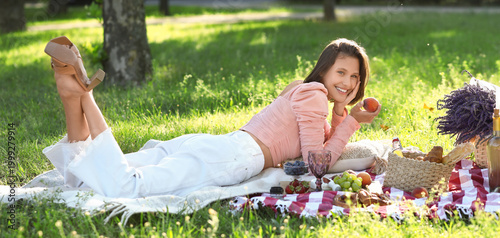 Beautiful young woman lying...