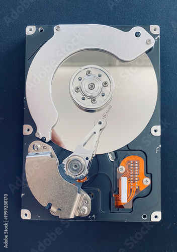 Close-up view of a disassembled single-platter vintage hard drive