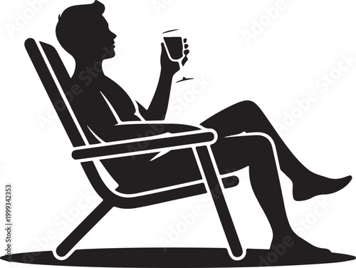 Silhouette of man relaxing in deck chair with drink