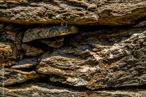 Ancient Greek slate flat stone rock wall, stacked flat stones plates stimata in Ikaria, Greece of Aegean island ancient old architecture schist