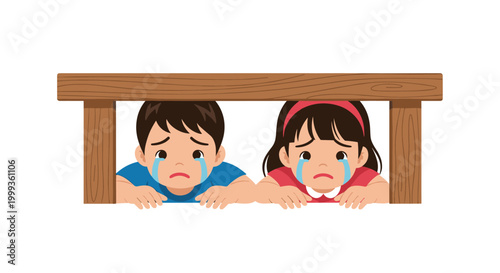 Sad young boy and girl crying while hiding under a wooden table during a scary situation or game of hide and seek.
