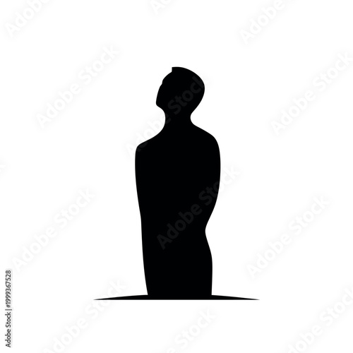 Silhouette of a standing young man.