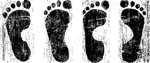 black grunge footprint set with textured rough edges isolated on white background