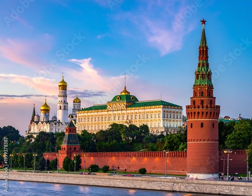 Moscow's Kremlin complex with golden domes and towers along riverbank against a colorful, evening sky
