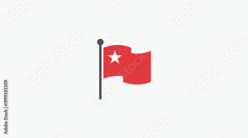 A red flag with a white star waves on a gray pole outdoors.