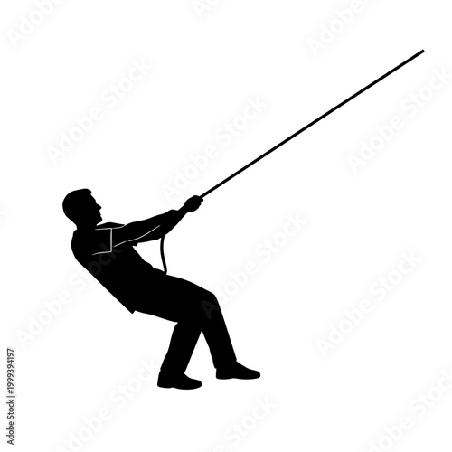 Bild auf Leinwand Silhouette of a person leaning back and pulling hard on a rope angled upwards