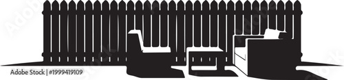 Silhouette of outdoor seating area with fence backdrop
