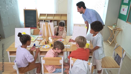 Art teacher presenting colorful painting to diverse students in classroom, inspiring creativity and imagination