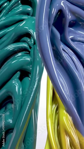 Glossy curved strands in green, blue and yellow create entangled abstract composition with smooth texture, close-up view, concept of digital art and motion