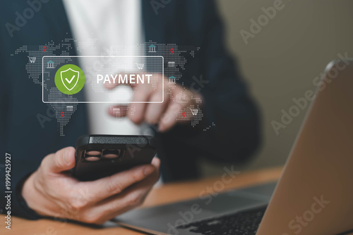 Businessman using smartphone for secure online payment with holographic world map and shield icon interface.
