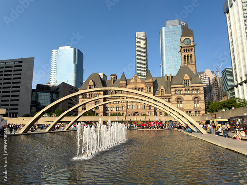 Toronto, Ontario, Canada, June 12, 2025: The Nathan Phillips Square, Fountain, and the Old City Hall.