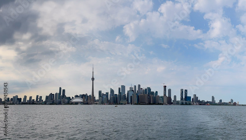 Toronto, Ontario, Canada, June 13, 2025: Toronto Skyline and Lake Ontario from Centre Island. The CN Tower and Rogers Center in Downtown Toronto from Toronto Center Island.