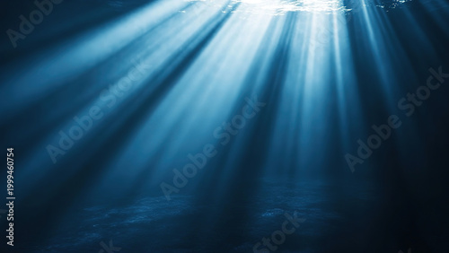 Sunlight penetrates the blue water under the sea. Dramatic sunlight. Underwater view 