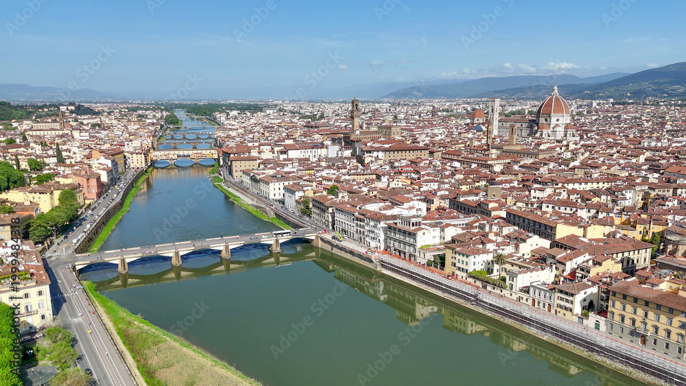 Fototapeta premium Drone aerial perspective Firenze Lungarni Arno River banks with Renaissance architecture colorful facades and Florence cityscape
