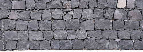 Tableau sur toile Panoramic texture of natural volcanic stone wall from Tenerife Island, Spain