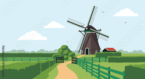 Traditional tall Dutch windmill standing in a flat green rural landscape with a path leading towards the structure under a blue sky.