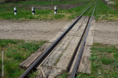 Old railway crossing on a dusty road