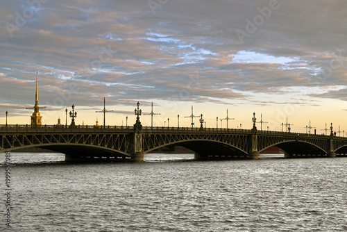 Photos Troitsky (Trinity) Bridge, 10-span structure ofopening system with single-wing draw span at left bank Neva river on summer morning