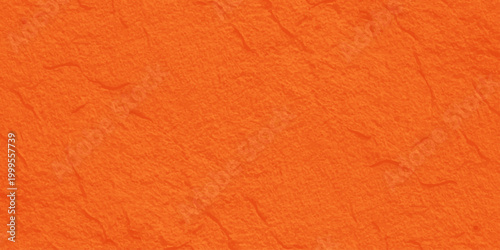 Vibrant orange handmade paper texture background with organic fiber grain detail. A blank orange paper and rough leather texture background, old material surface pattern with a red textile structure