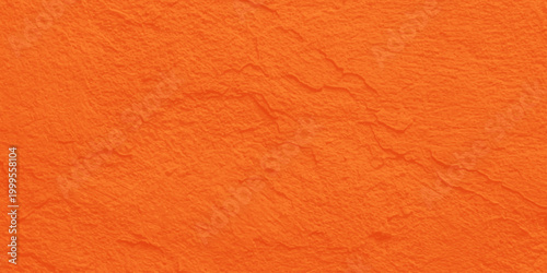 Vibrant orange handmade paper texture background with organic fiber grain detail. A blank orange paper and rough leather texture background, old material surface pattern with a red textile structure