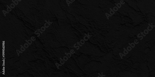 Dark black slate stone texture background, Matte charcoal rock surface for minimalist professional graphic design layout. A dark grunge texture with a rough black paper surface, weathered backdrop