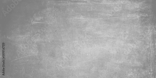 Aged black and white grunge metal texture featuring a dark gray concrete wall pattern. Light gray cement texture background with subtle weathered grit effects for industrial and modern graphic design