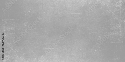 Aged black and white grunge metal texture featuring a dark gray concrete wall pattern. Light gray cement texture background with subtle weathered grit effects for industrial and modern graphic design