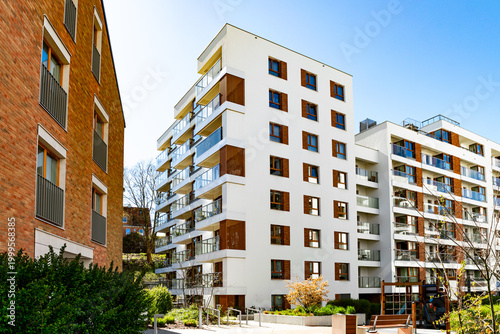 Beautiful new block house in the blooming garden. Housing development in Europe