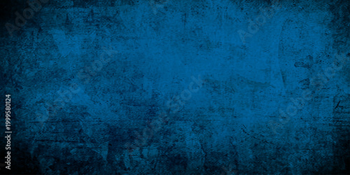 Obraz na plátně A dark vintage backdrop featuring an aged blue grunge texture on a rough wall su