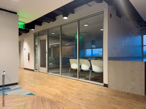Canvastavla Modern corporate office hallway interior with sleek glass partition walls, expos
