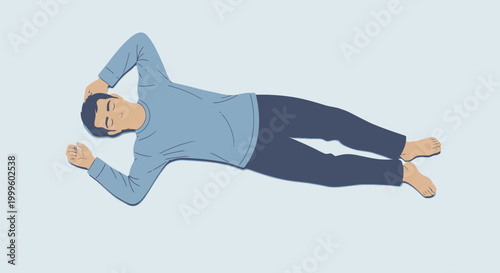 Man lies on floor relaxing in quiet room.
