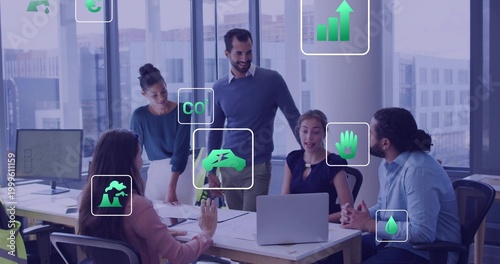 Collaborating 5-person team in business attire, pointing at laptop, docs, eco icons at office table