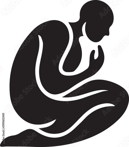Silhouette Of A Person Kneeling In Contemplation Or Prayer