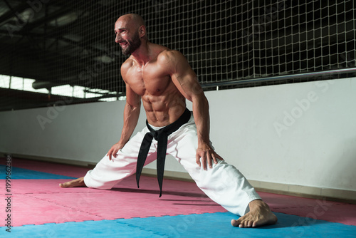 Photos Karate Man In A Kimono Limbering Up