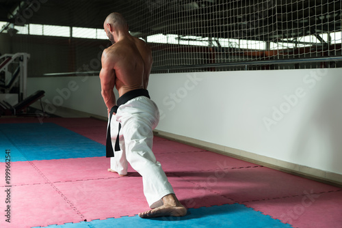 Photos Karate Man In A Kimono Limbering Up
