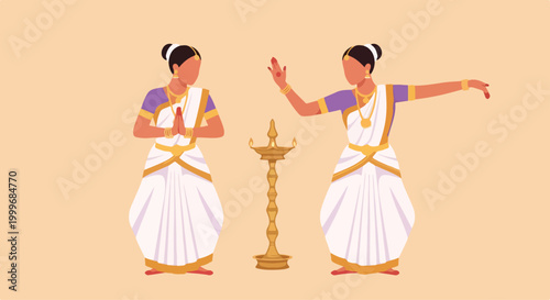 Two women dressed in traditional Indian attire performing a cultural dance with a decorative lamp in the center