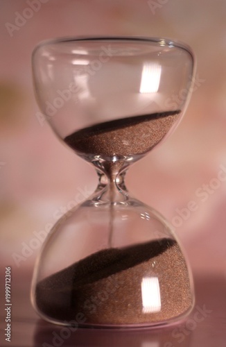 Hourglass as symbol of passing time concept photo vertical orientation art 