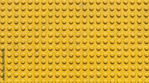 Yellow Tactile Paving with Regular Grid of Truncated Dome Bumps