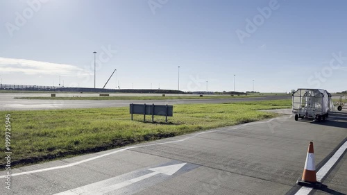 Empty baggage carts parked at airport panning