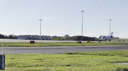 Private jet taxiing on runway 4K