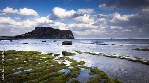 Photos The seaside in winter was filled only with simple colors and a cold winds! Unique landscape of Seongsan Ilchulbong-Oreum(small extinct volcano) in winter, Jeju Island, South Korea